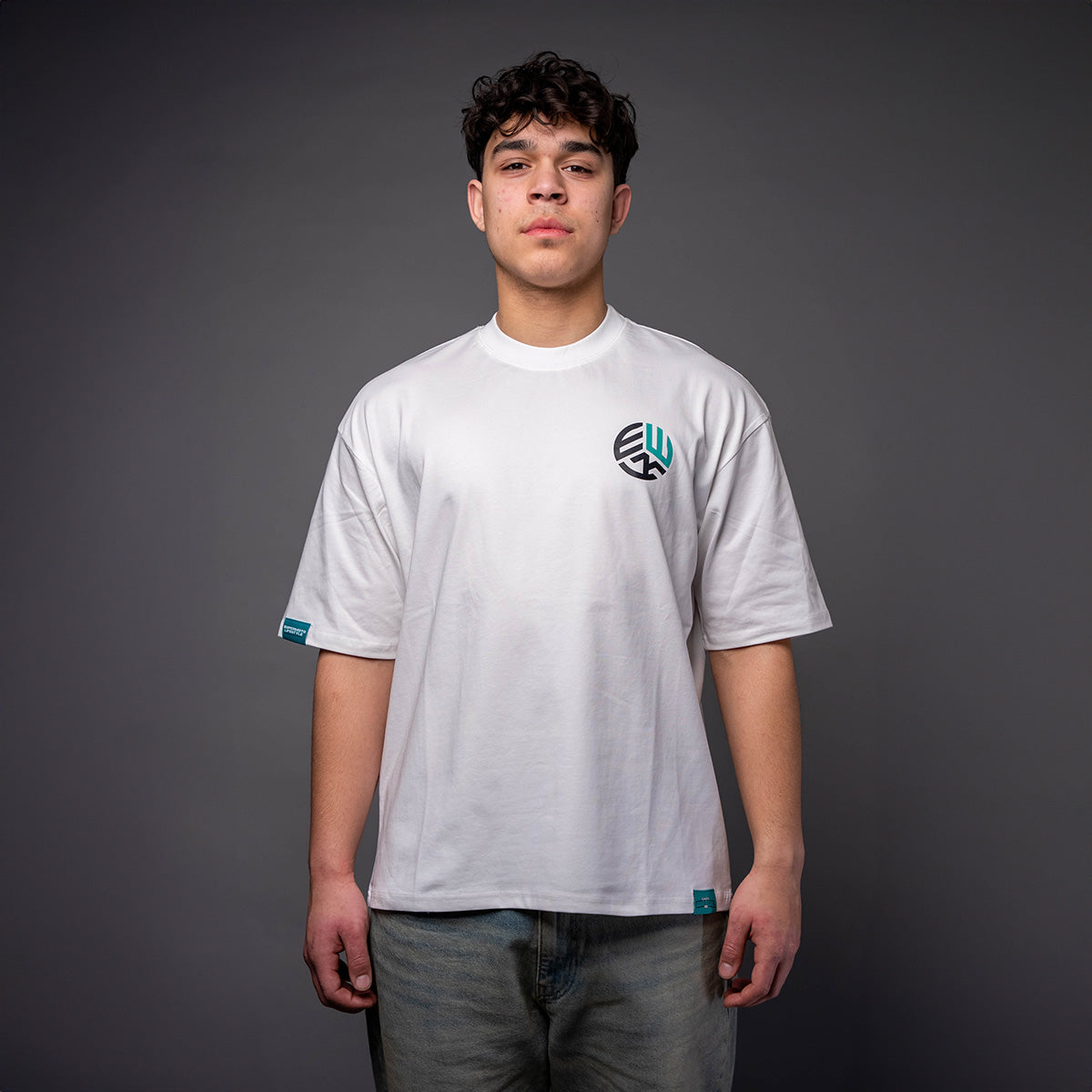 Man wearing white EWK Signature T-shirt with EWK logo for supermoto riders